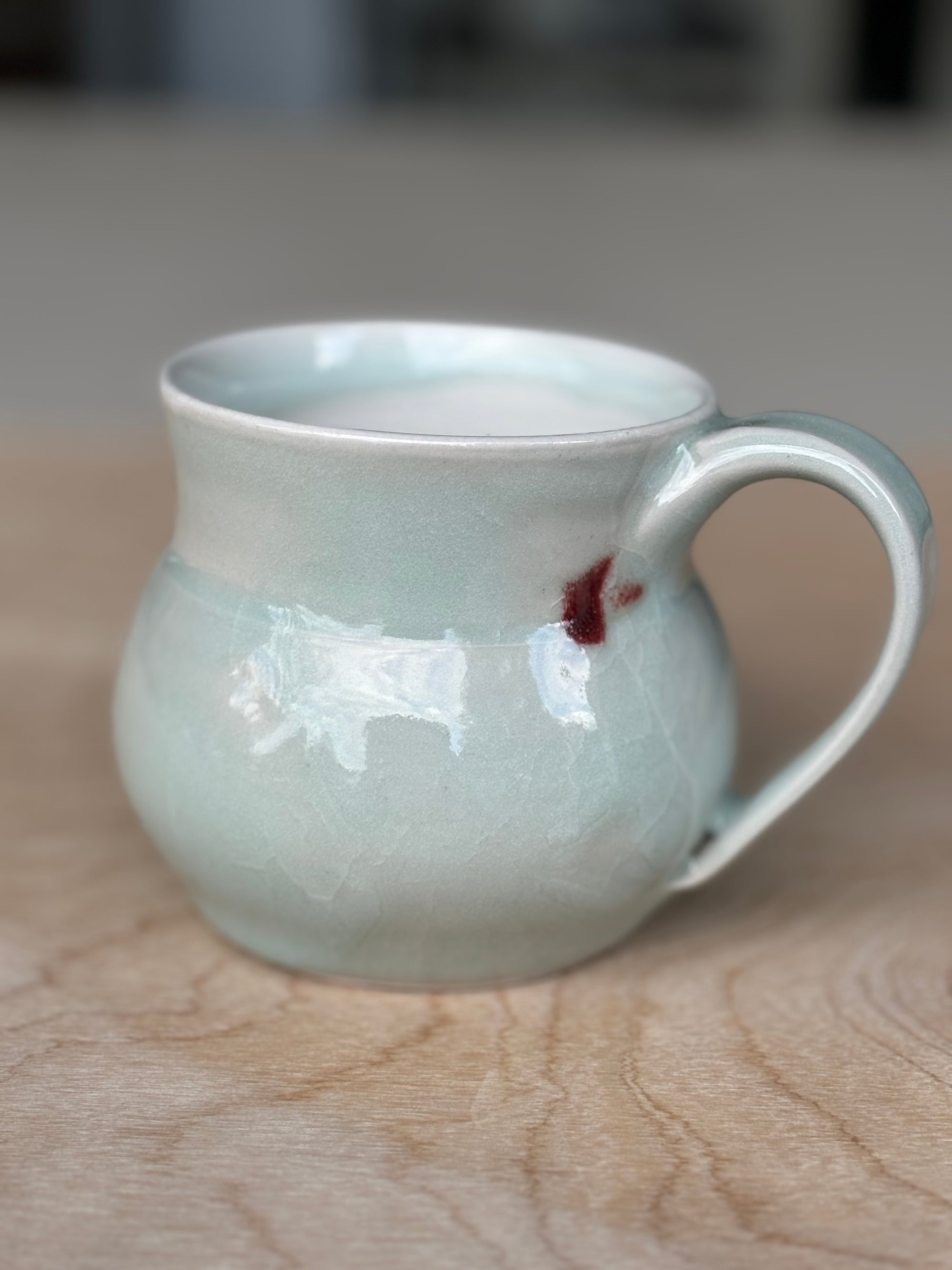 Light Blue Porcelain Mug with Crimson Spot