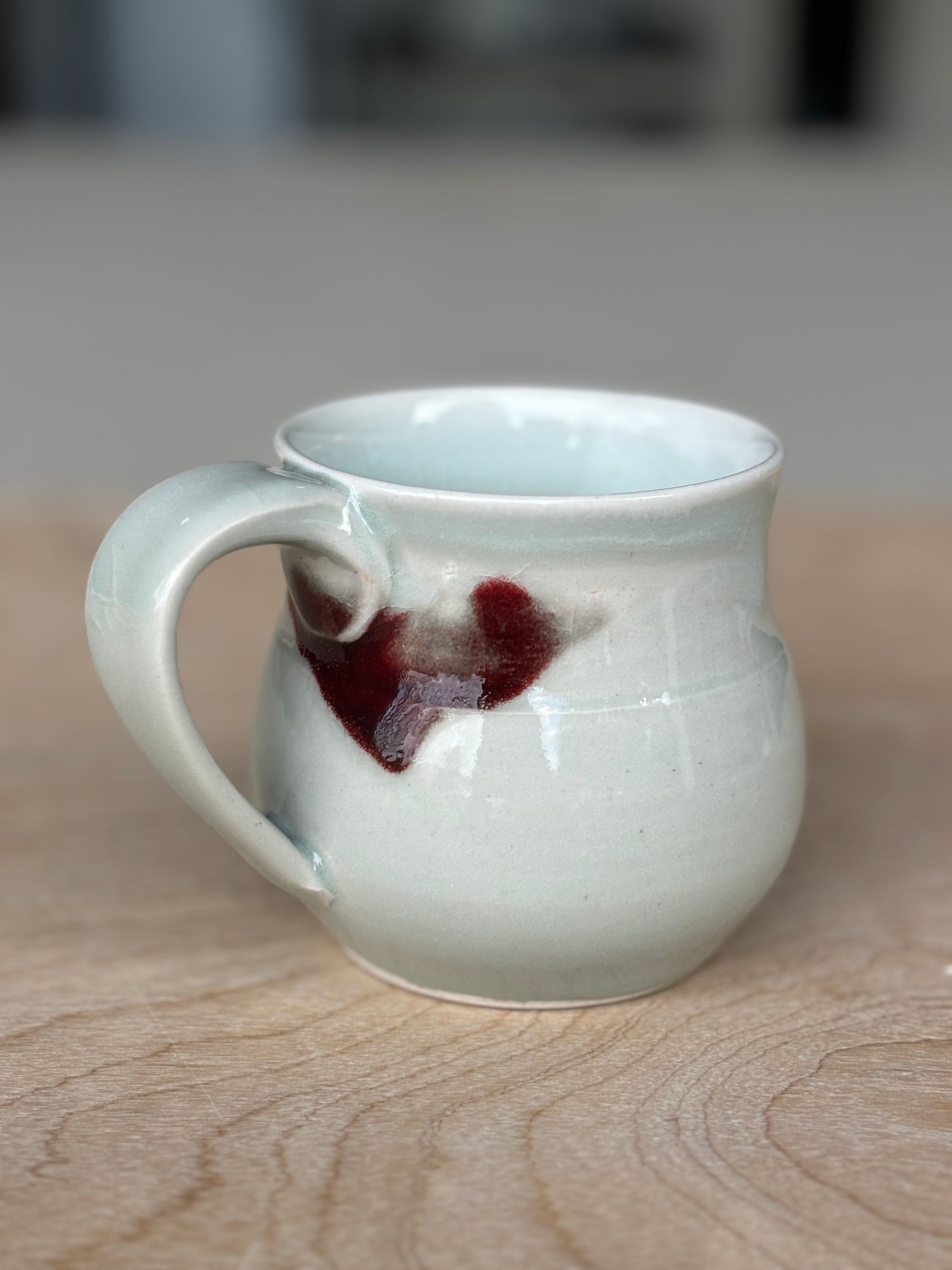 Light Blue Porcelain Mug with Crimson Spot