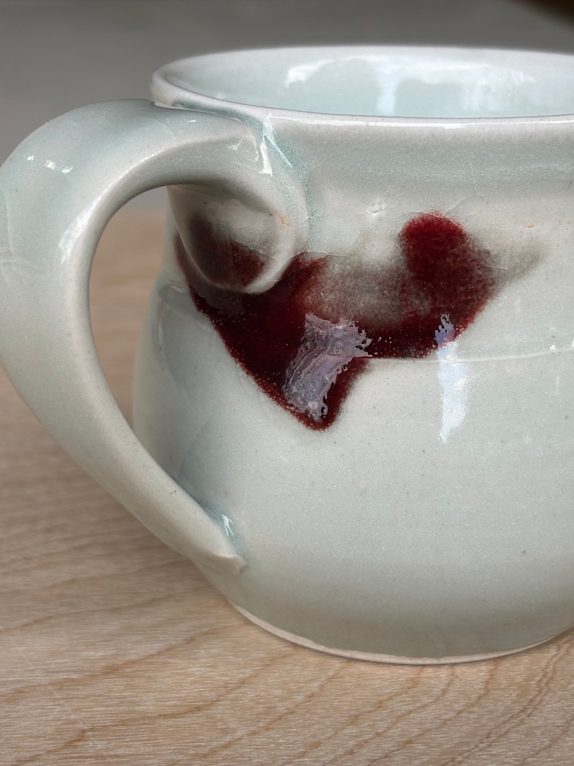 Light Blue Porcelain Mug with Crimson Spot